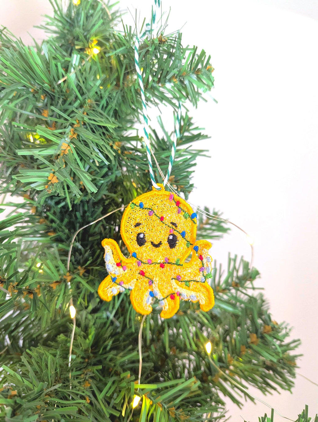 Embroidered hanging Octopus, Christmas decorations, wrapped in lights, machine embroidery