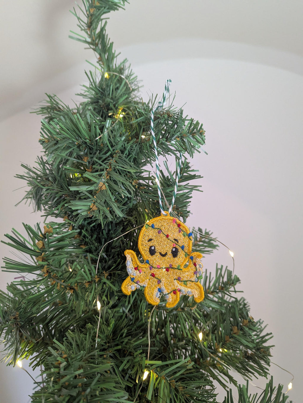Embroidered hanging Octopus, Christmas decorations, wrapped in lights, machine embroidery