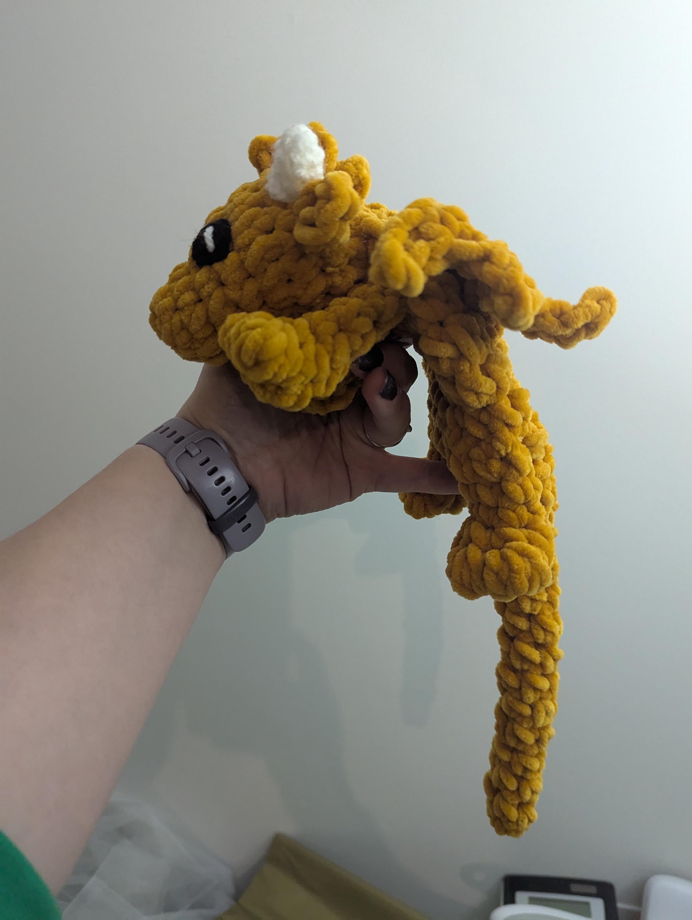 Plush crocheted dragon lovey, soft cuddly toy