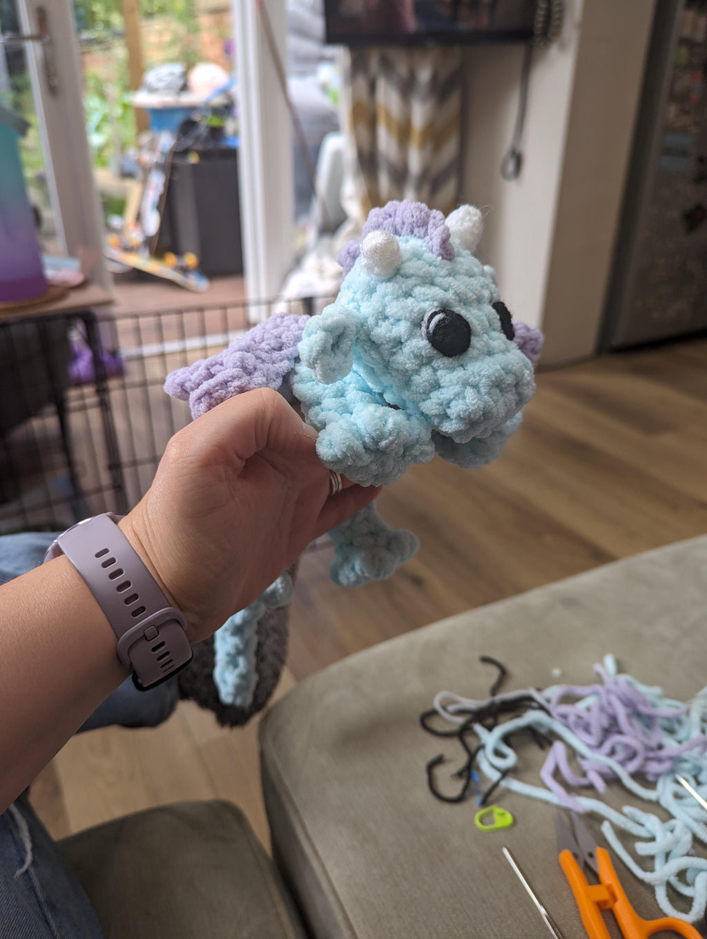 Plush crocheted dragon lovey, soft cuddly toy