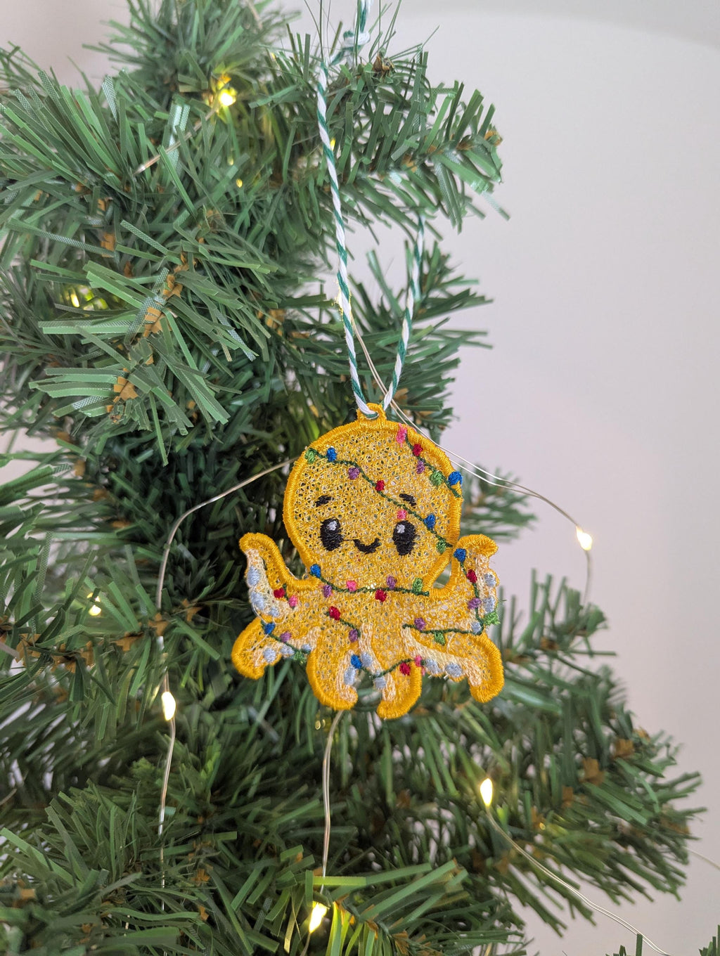Embroidered hanging Octopus, Christmas decorations, wrapped in lights, machine embroidery