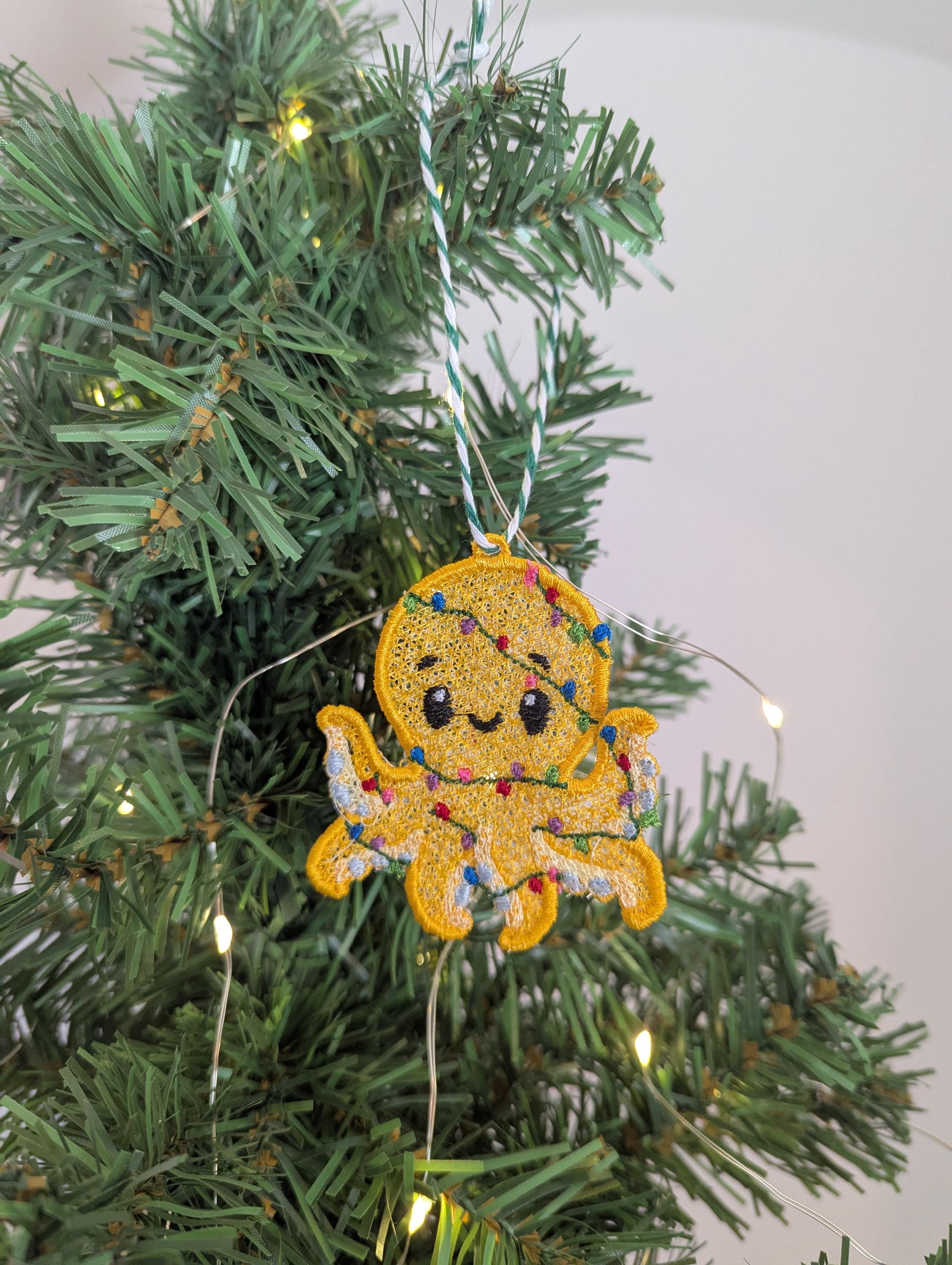 Embroidered hanging Octopus, Christmas decorations, wrapped in lights, machine embroidery